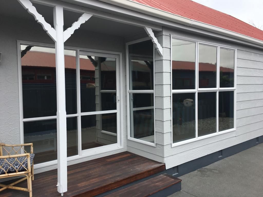 A white house with a red roof - Christchurch, NZ - Tint A Window