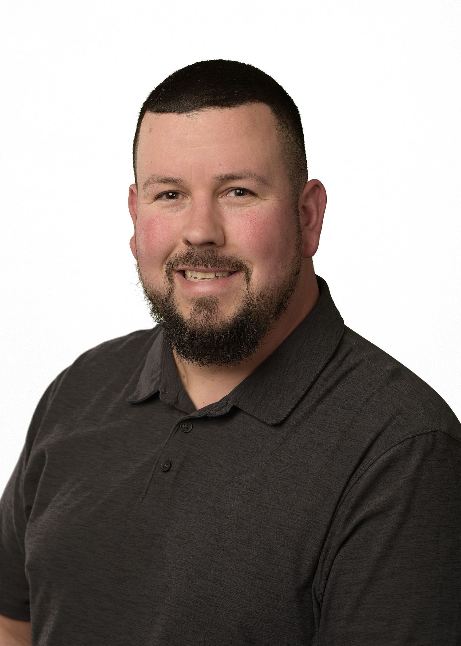 A man with a beard is wearing a blue shirt with the word fuller 's on it.