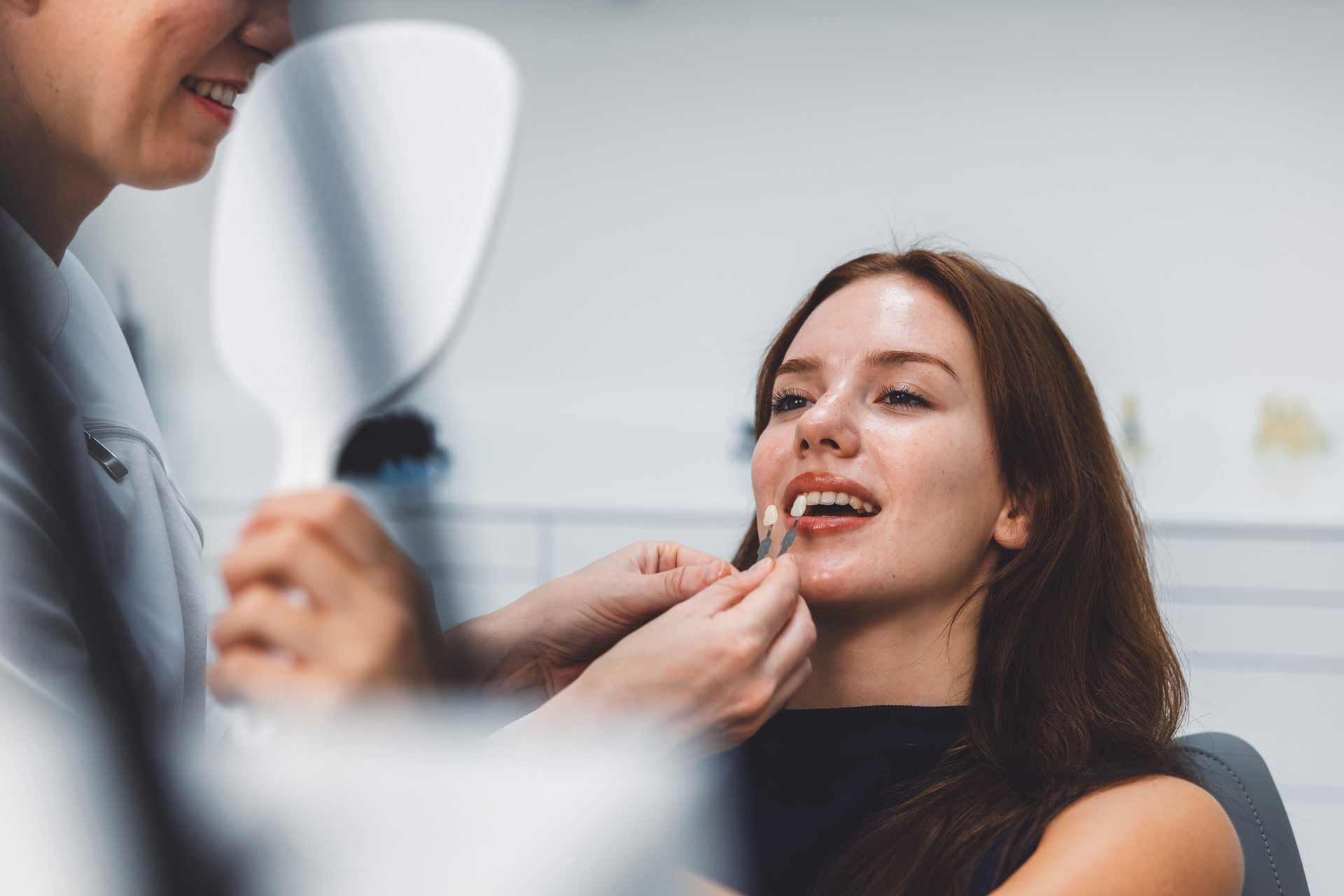 A woman undergoing teeth cleaning at Gregory S. Rutherford, DDS, PA, known for cosmetic dentistry in Lakewood Ranch, FL