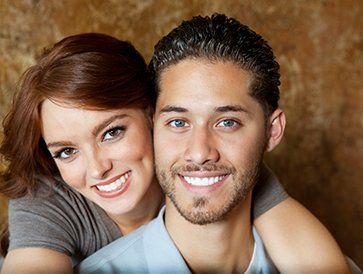 Dental Implant Restorations — Smiling Couple in Sarasota, FL