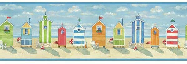 A row of colorful beach huts on a beach.