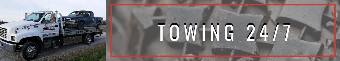 Tow truck towing a vehicle; 