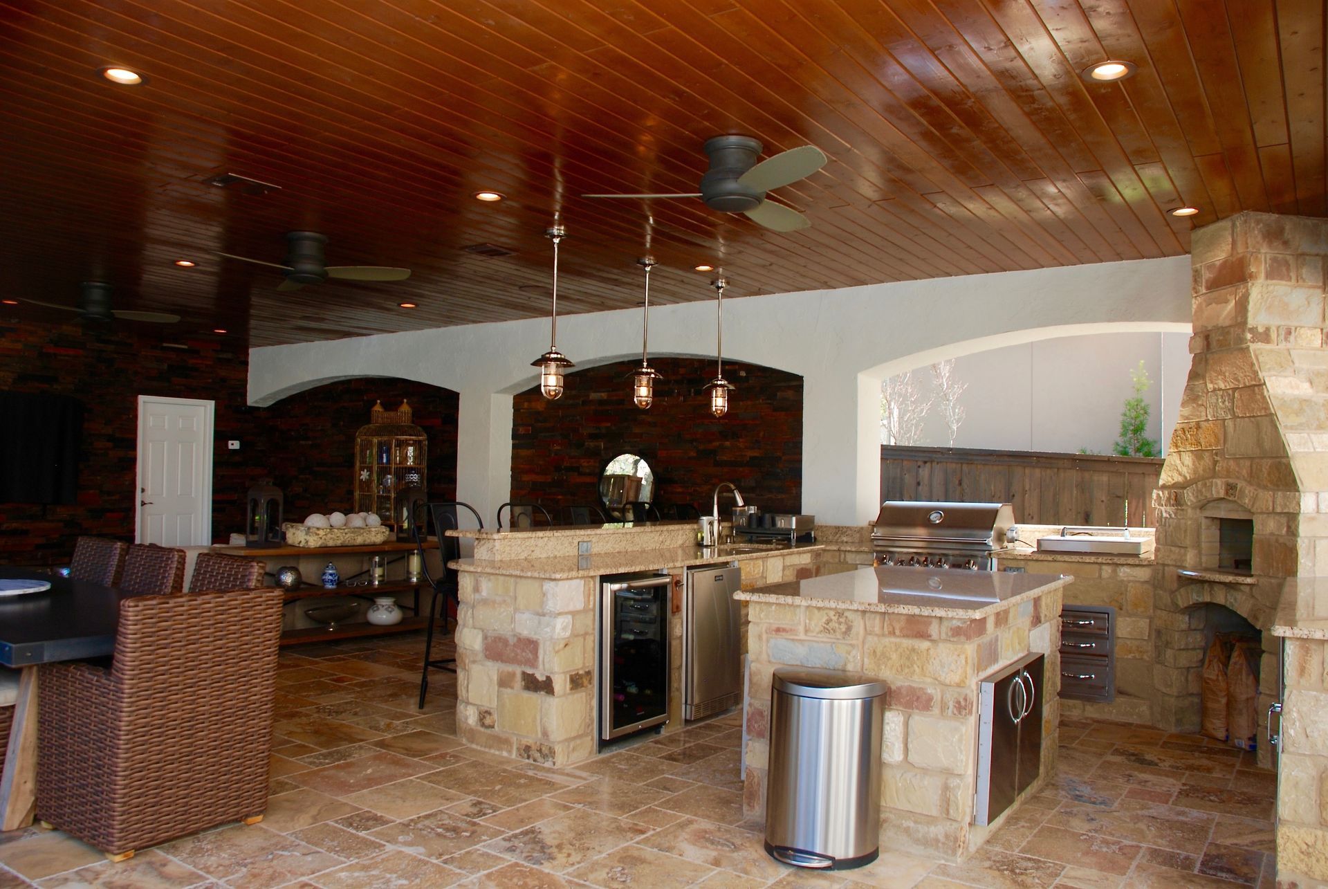 A kitchen with a ceiling fan and a trash can built by Fine Patio Design San Antonio TX