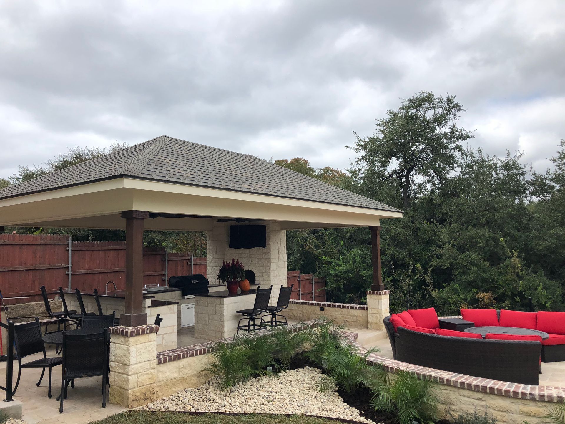 A patio area with a gazebo and a couch built by Fine Patio Design San Antonio TX