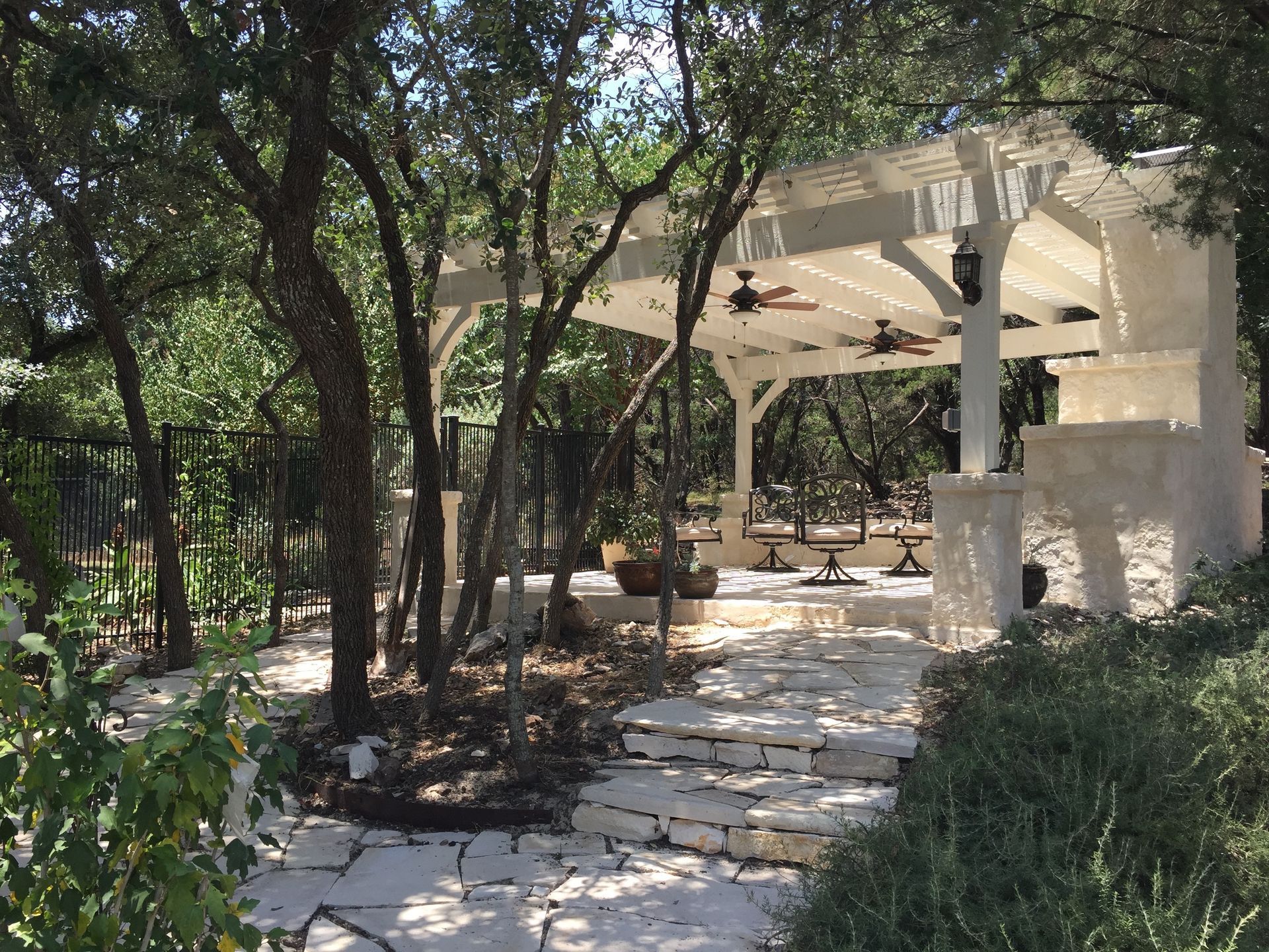 A gazebo in the middle of a lush green forest built by Fine Patio Design San Antonio TX