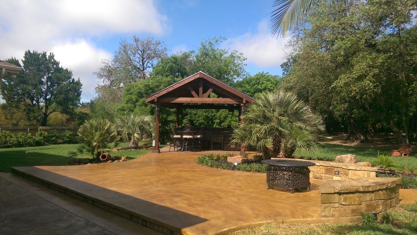 A gazebo in the middle of a lush green field built by Fine Patio Design San Antonio TX
