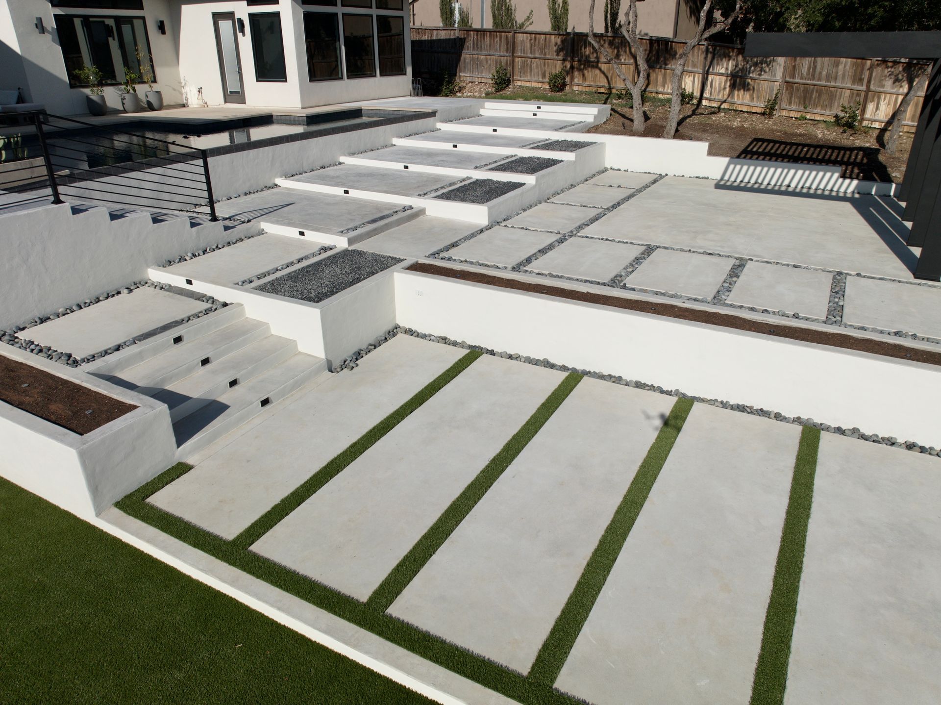 A concrete decorative patio with lines built by Fine Patio Design San Antonio TX