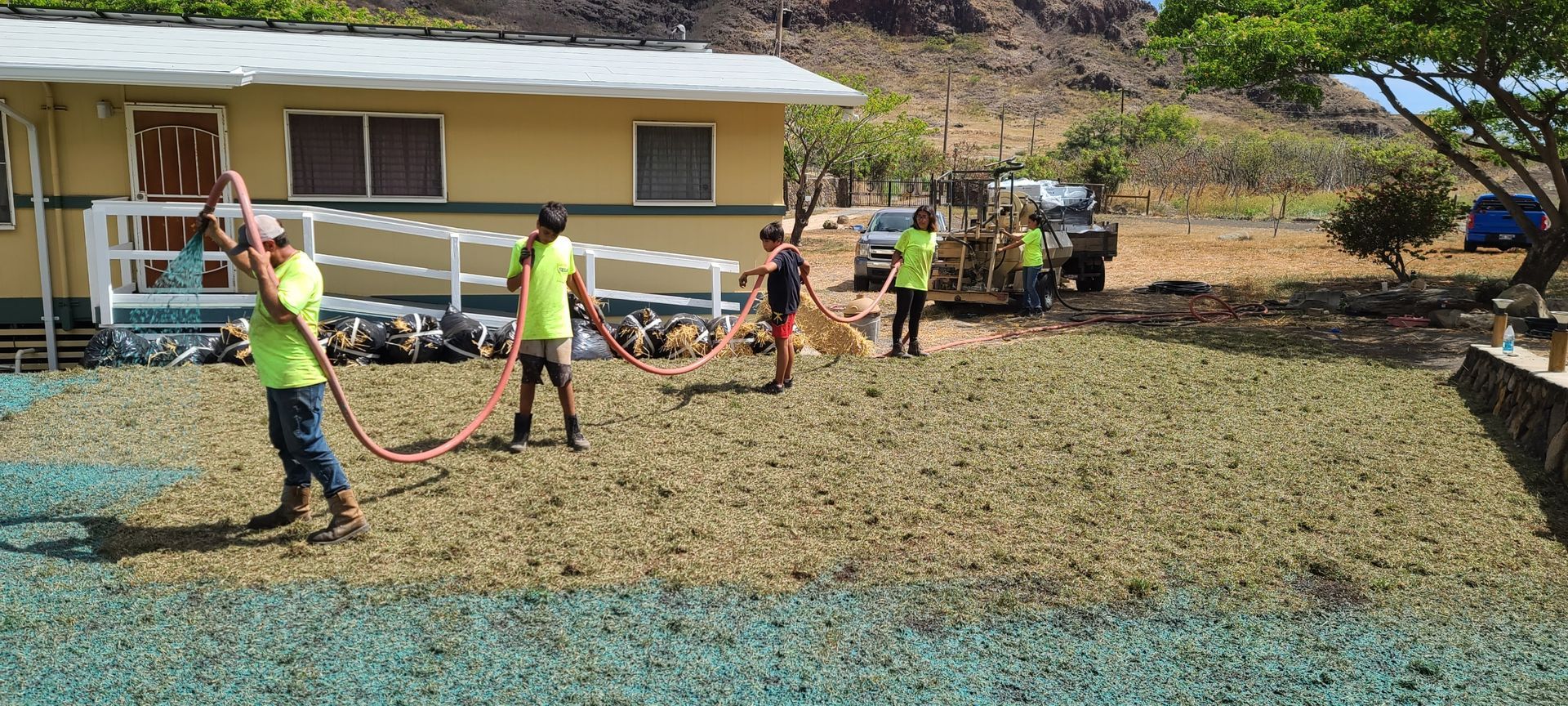 employees installing hydroseeding