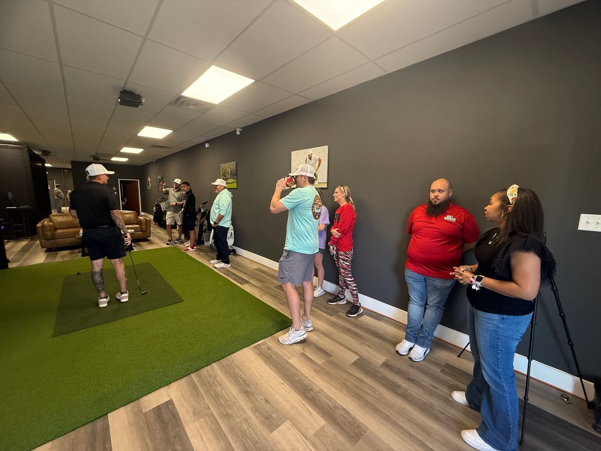 A group of people are standing in a room.