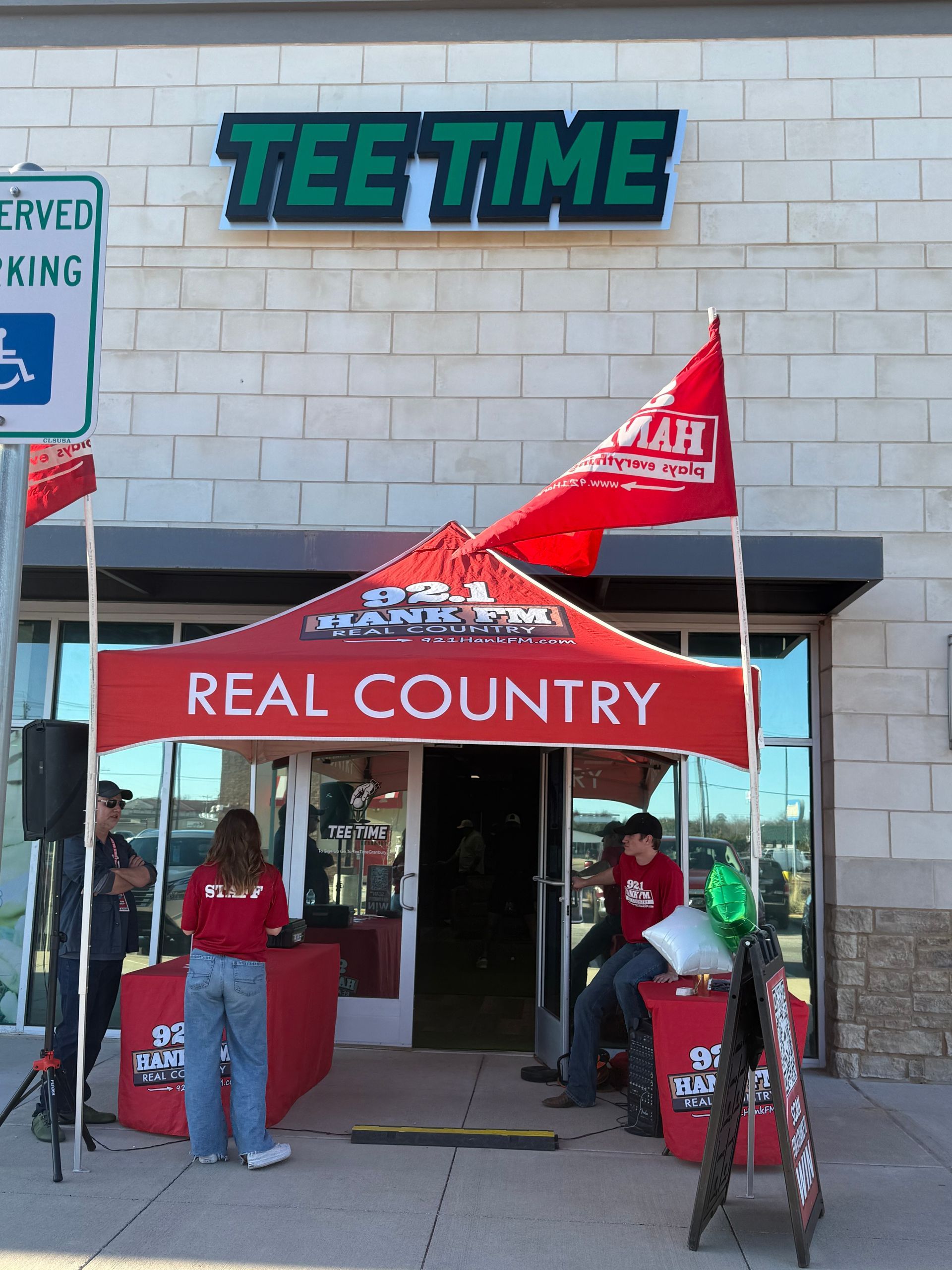 People standing outside of a tee time store