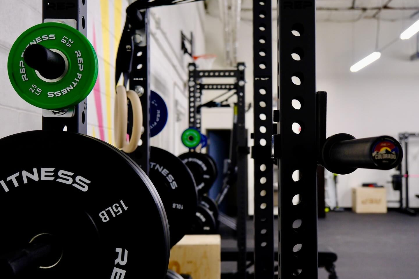 People doing yoga in a studio with raised arms.