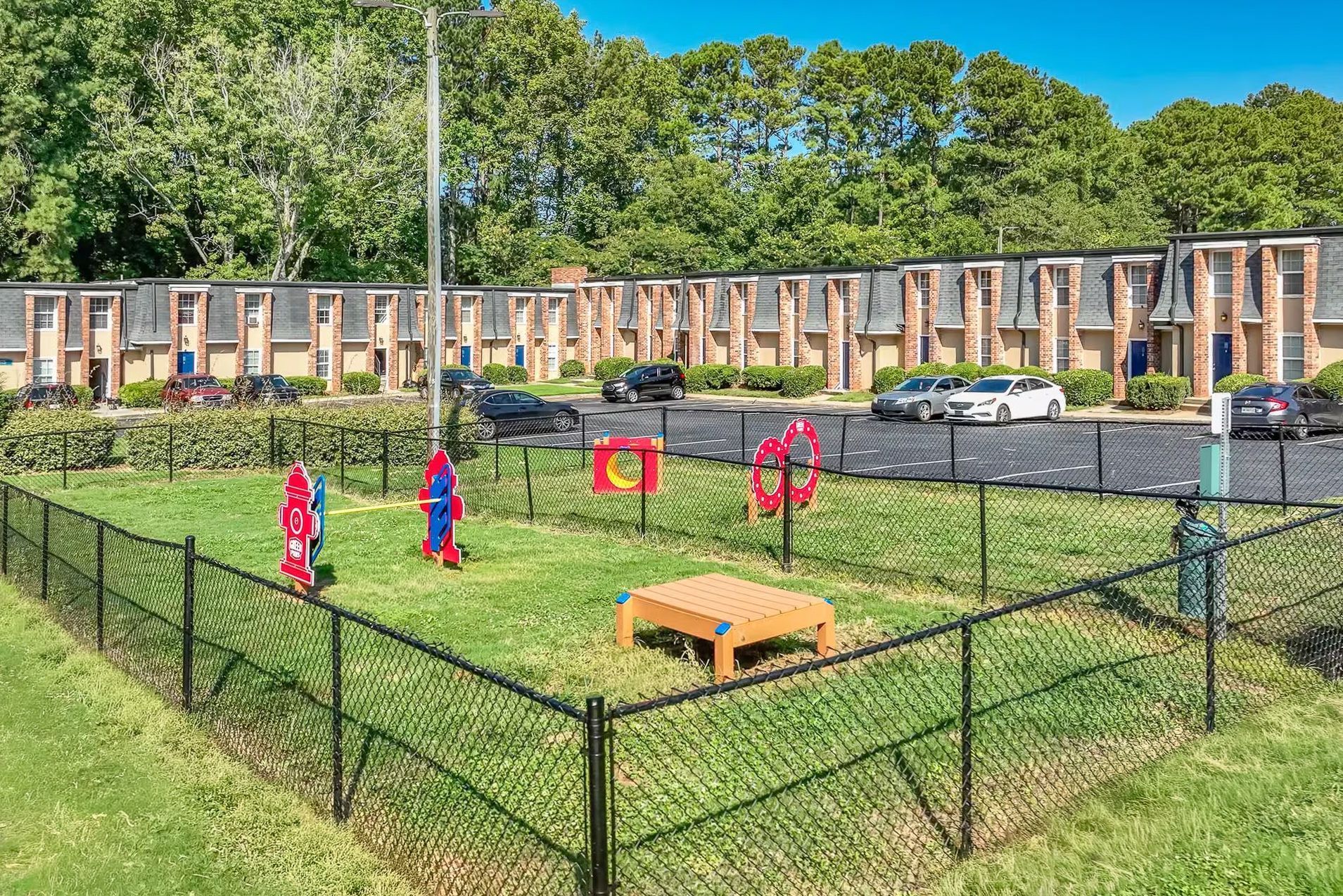 A small, modern kitchen with stainless steel appliances and white cabinets.