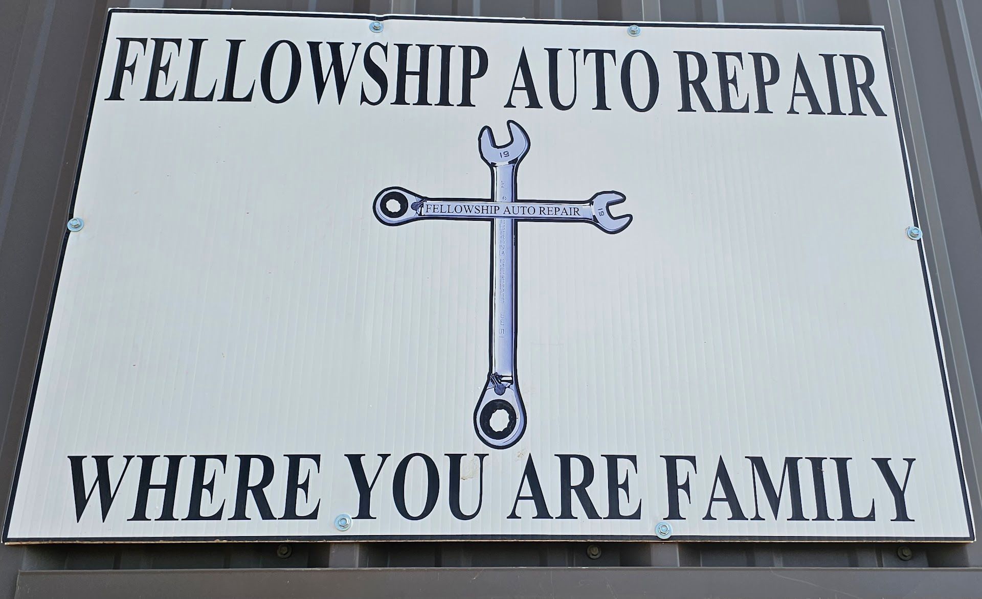 A Sign That Says Fellowship Auto Repair Where You Are Family | Fellowship Auto Repair