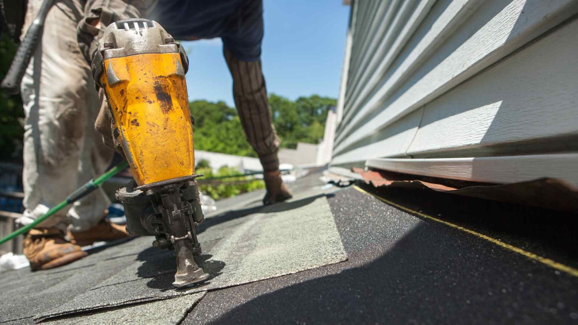 TrustWorks Construction_Picture of a  a roofer fixing the damaged roof.