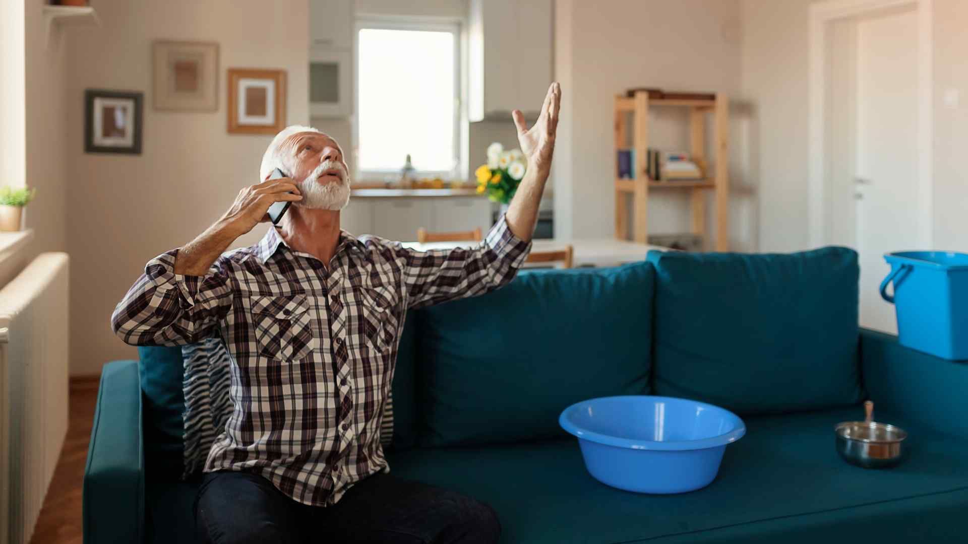 TrustWorks Construction_Picture of an old man complaining about his roof leak