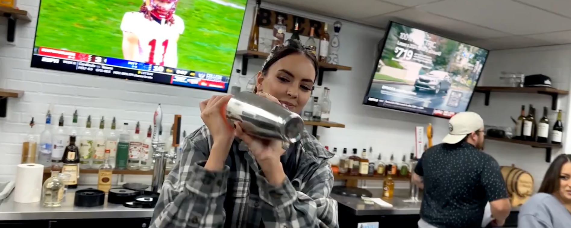 Bartender at Rewsters bar and grill making a cocktail