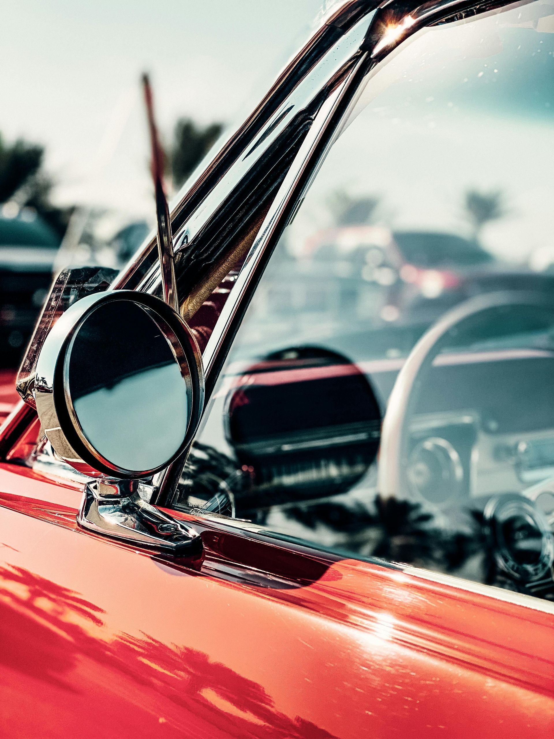 side window of a red vintage car