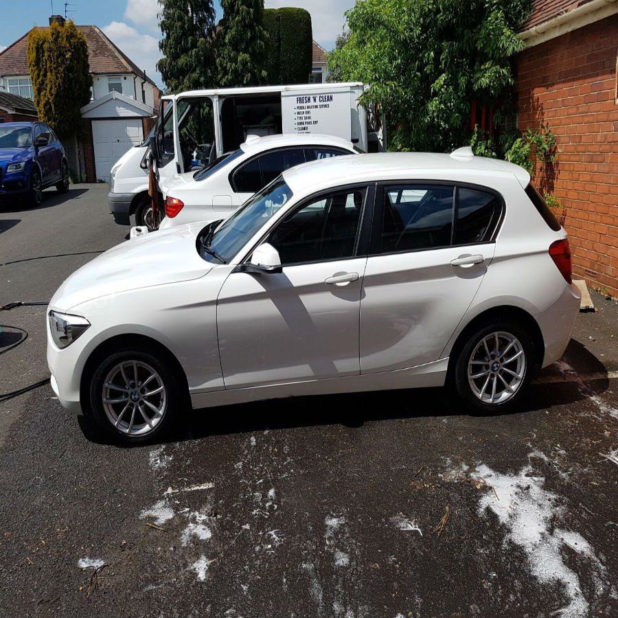 small car parked up that has just been washed