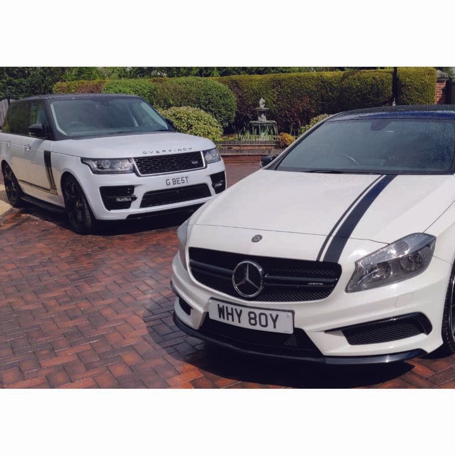 2 vehicles on a paved driveway after being cleaned