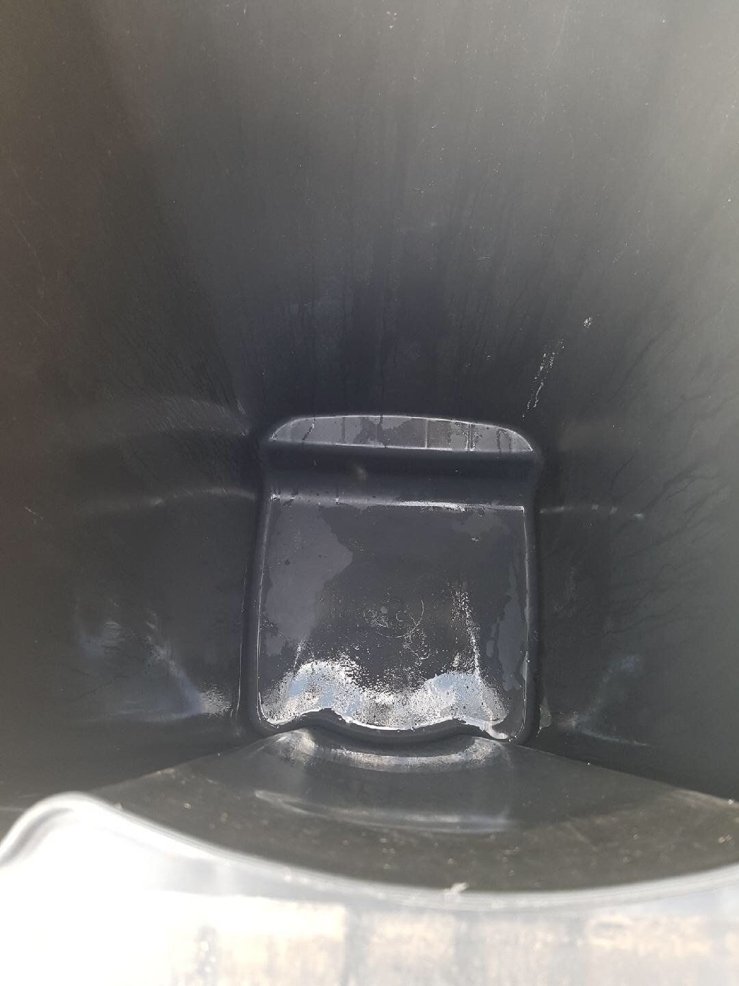 dirty wheelie bin before being cleaned