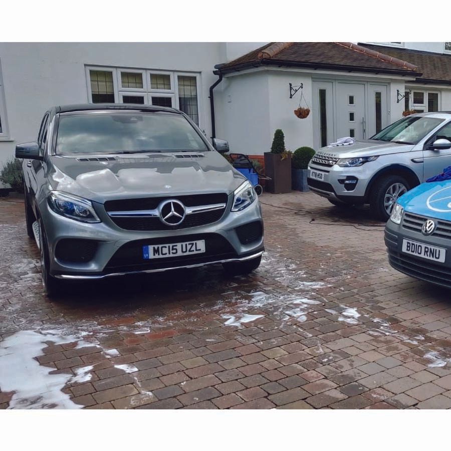 Mercedes parked on driveway being washed