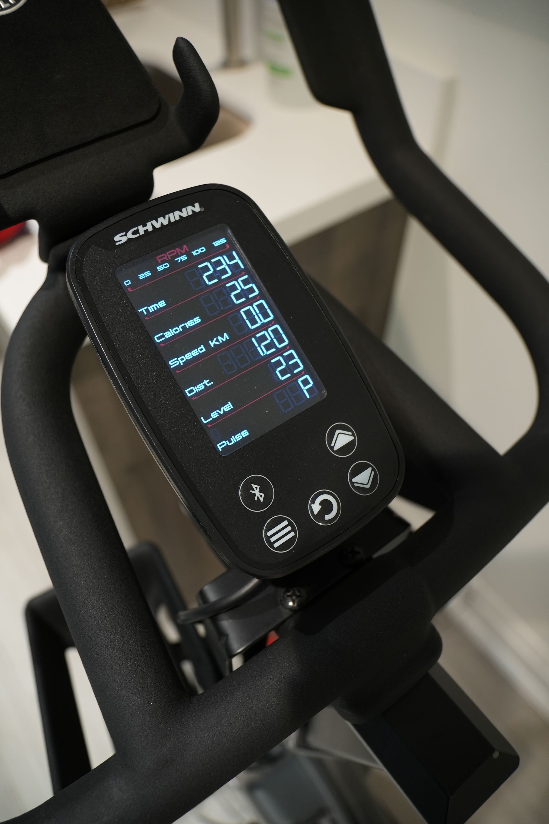 A close up of a schwinn exercise bike with a digital display