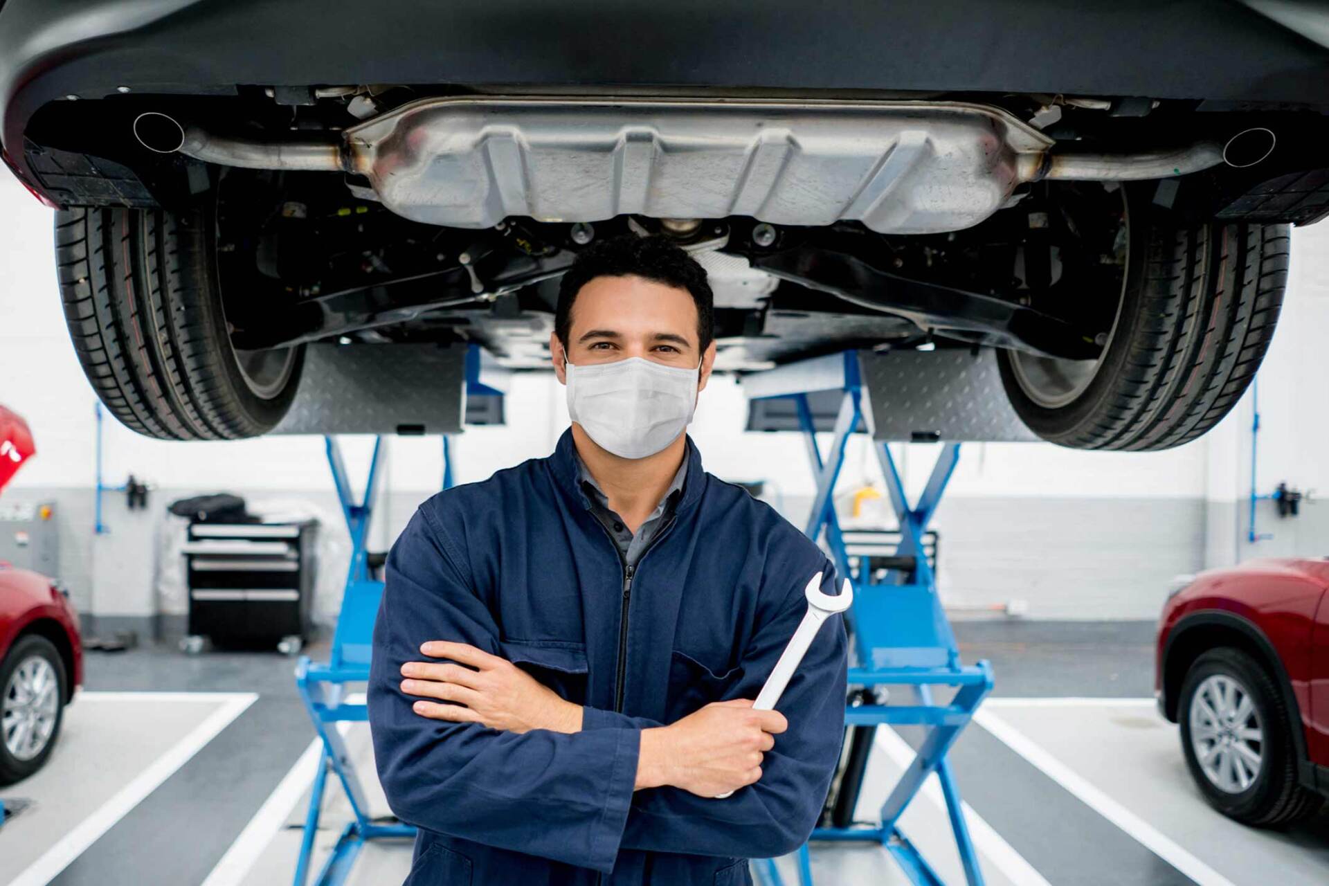 Mechanic holding wrench below car — Gary, IN — Macer Transportation
