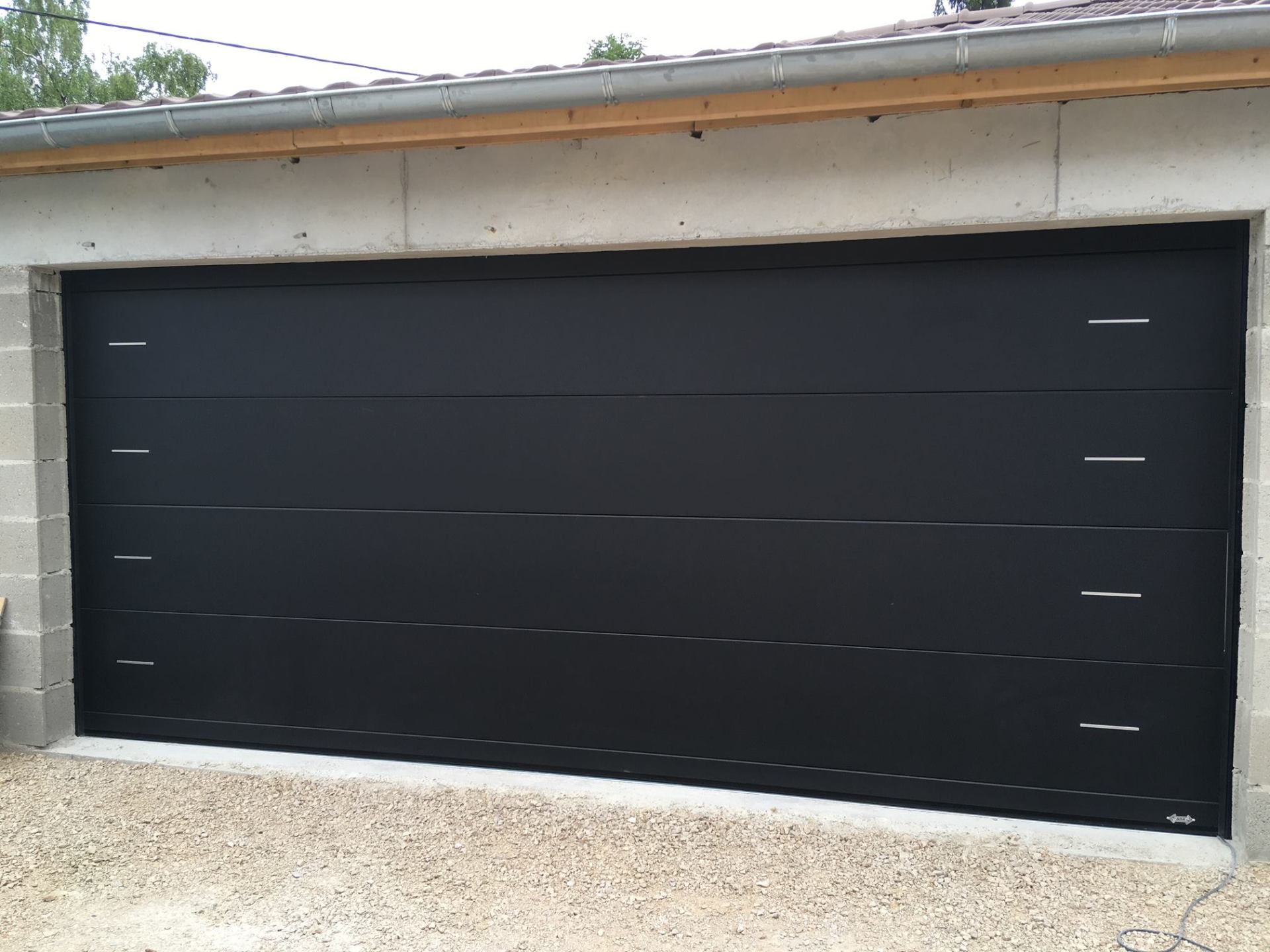 Porte de garage réalisation Trihome