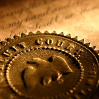 A close up of a court seal on a piece of paper