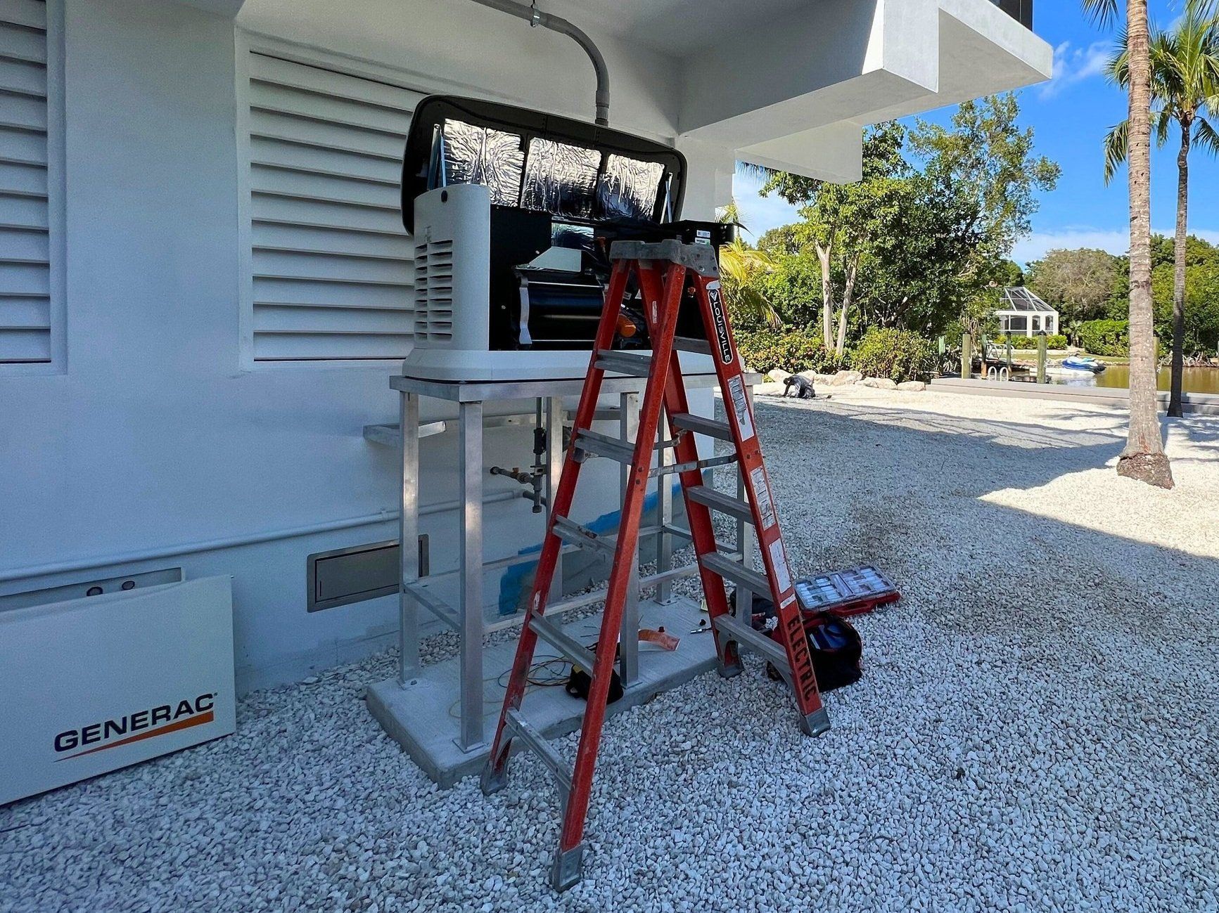 A ladder is sitting on top of a table in front of a building.