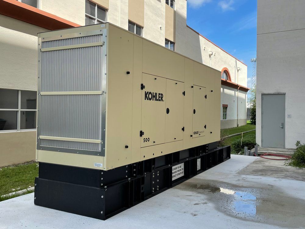 A large kohler generator is sitting outside of a building