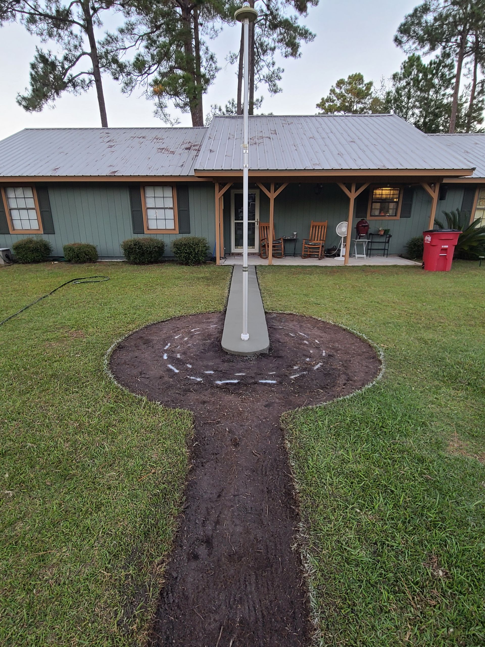 A house with a flag pole in front of it