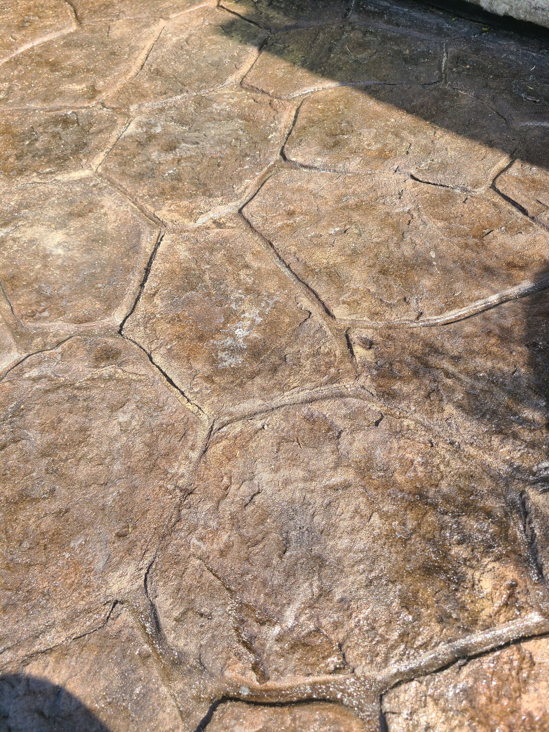 A close up of a concrete floor with a hexagon pattern.