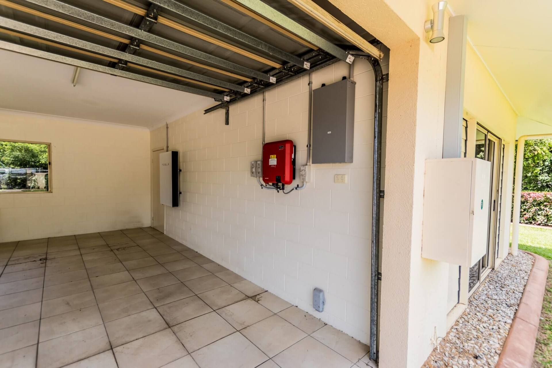 tesla charging in garage - Ample Electrical