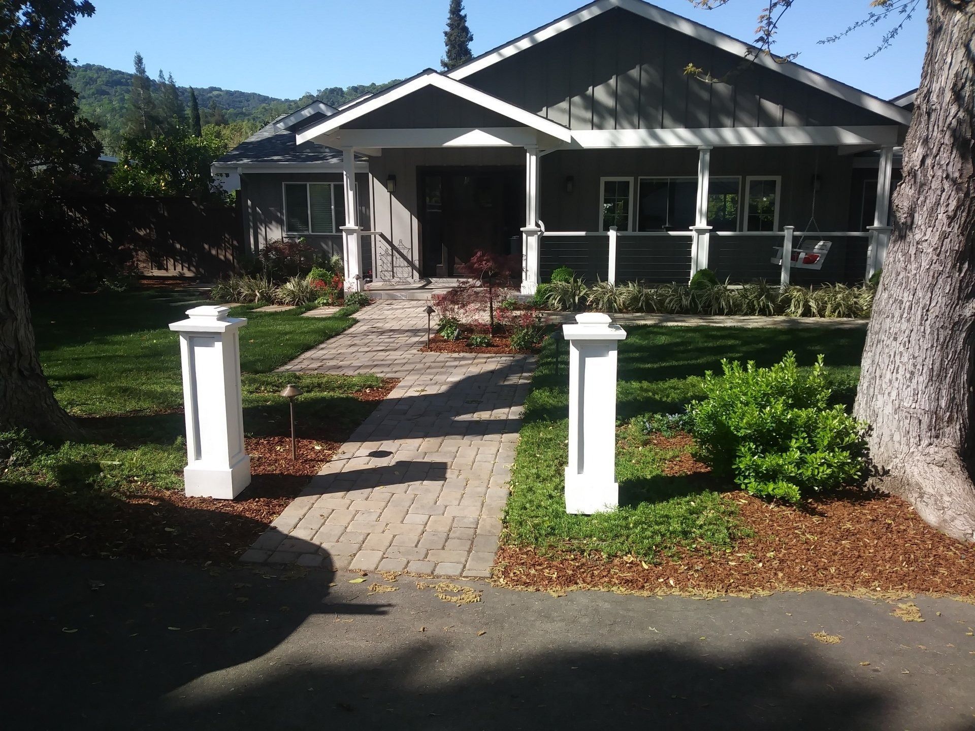 A house with a brick walkway leading to it