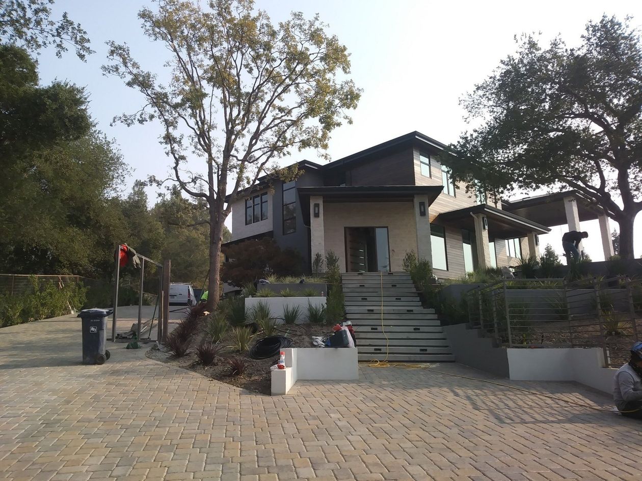 A large house with stairs leading up to it