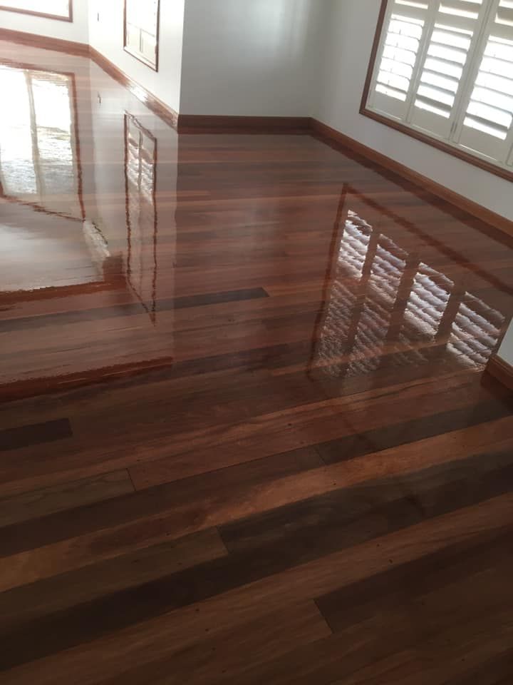 A Room With a Wooden Floor and Shutters on the Windows — Toowoomba Polished Floors in Clifton, QLD