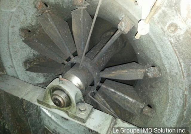 Un gros plan d'une machine avec les mots le groupe imq solution inc. en bas