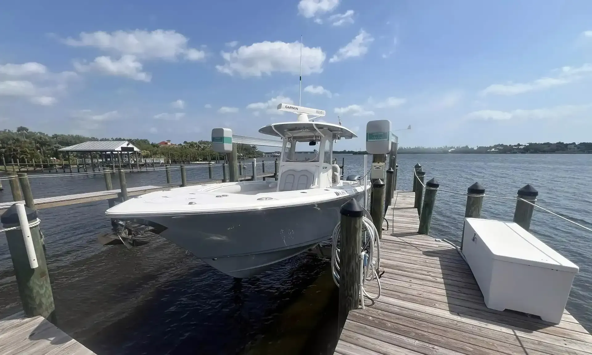A boat is docked at a dock in the water.