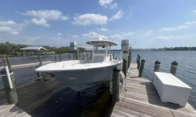 A boat is docked at a dock in the water.
