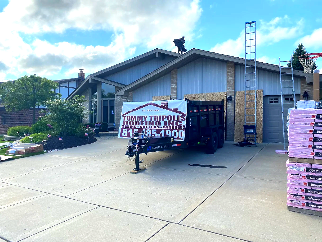 Roofing Contractor installing a new roof in Homer Glen, Illinois. Roofing Contractor installing a new roof in Homer Glen, Illinois.