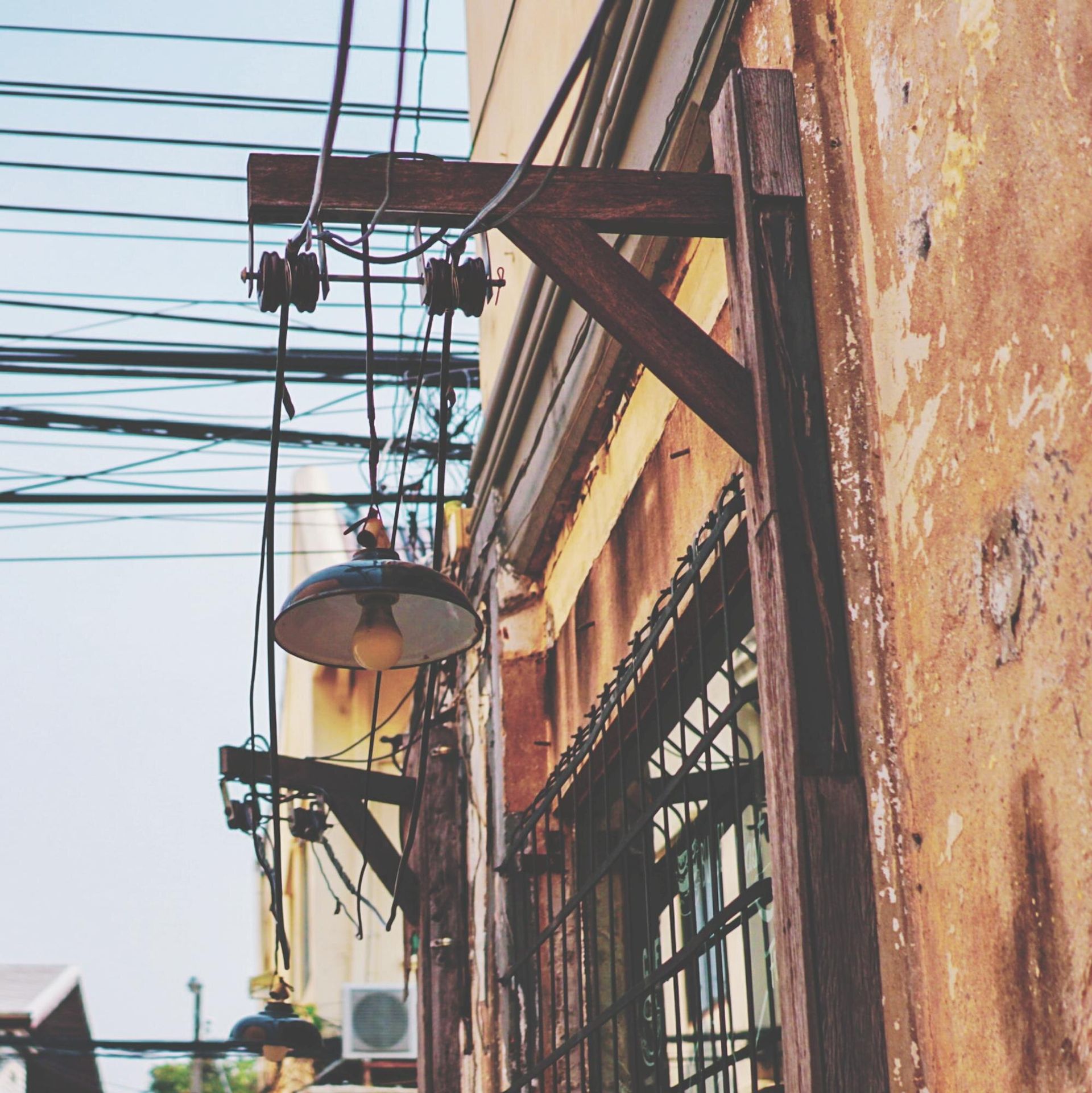 A building with a lot of wires hanging from it