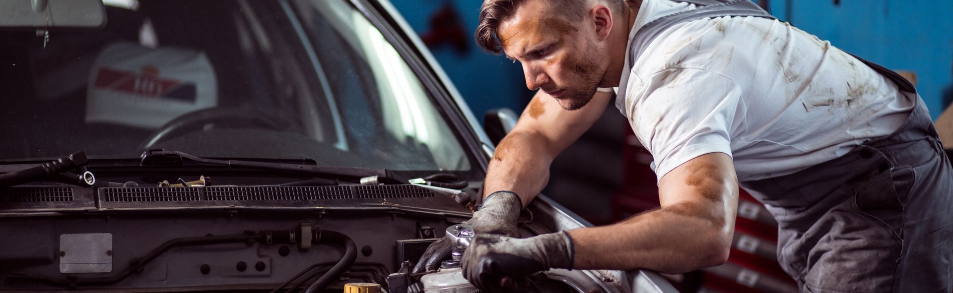 Auto Mechanic Repairing Engine Bay | VIP Service Center