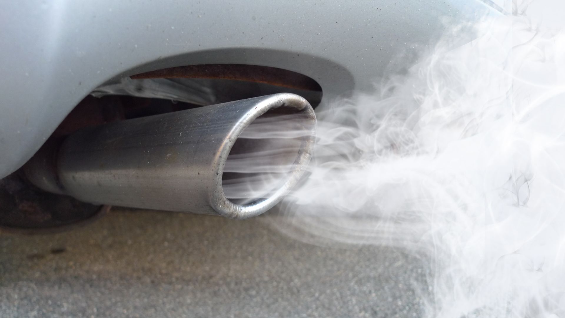 Car Exhaust Emitting Smoke During Emission Test | VIP Service Center