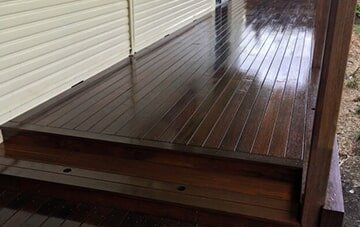 Freshly stained dark wooden decking in Toowoomba