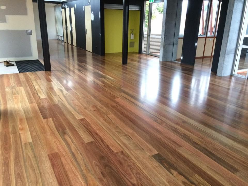 A Wood Floor with Black Columns
