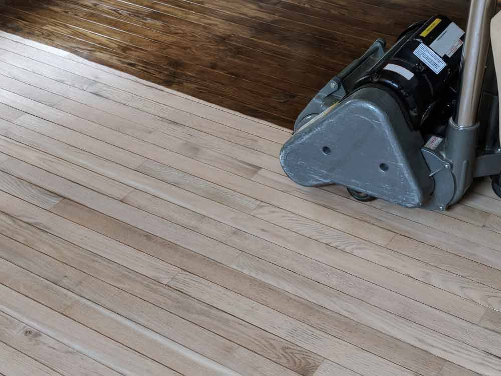 Sanding Hardwood Floor With Grinding Machine — Floor Services in Kleinton, QLD