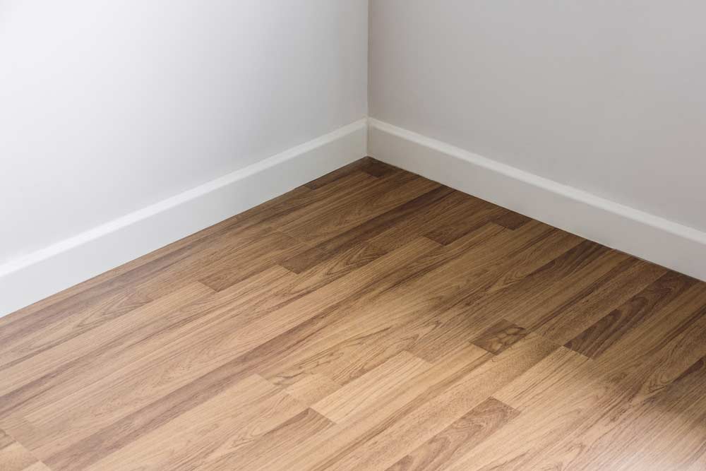 Wood Floor With White Wall — Floor Services in Kleinton, QLD