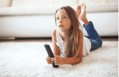 girl watching TV on cleaned carpet in st paul mn