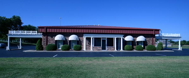 A large building with a lot of windows and awnings